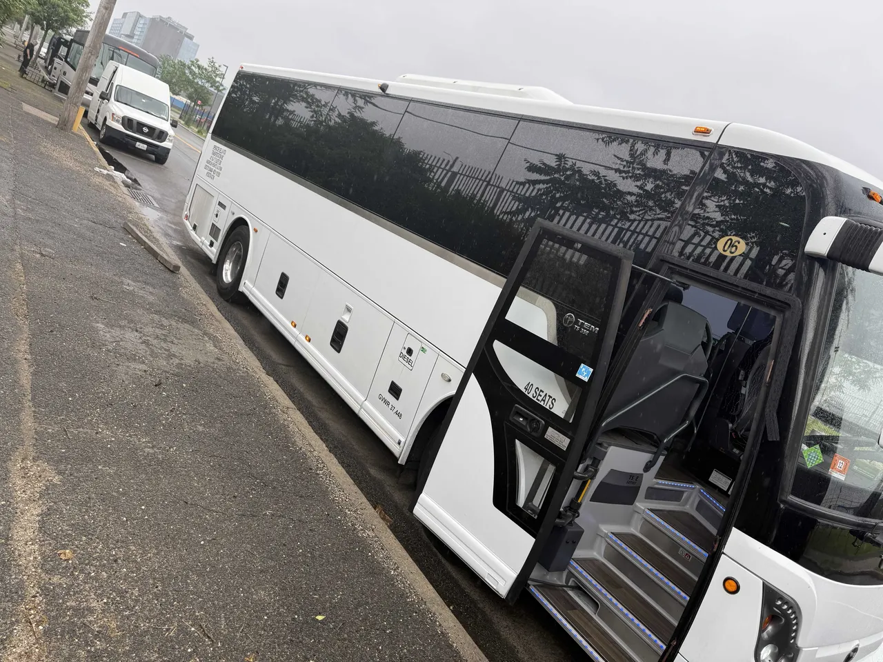 White 40 Passenger Charter Bus with tinted windows for charter bus rental