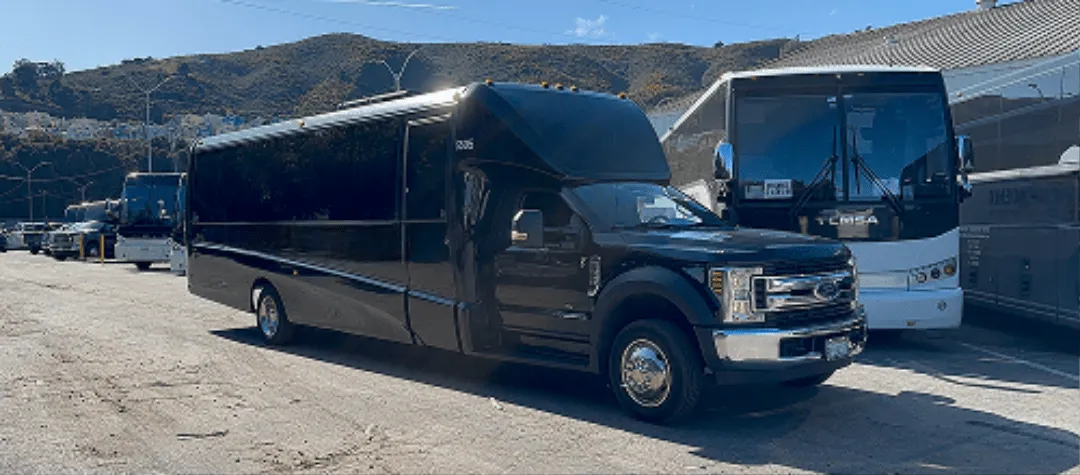 24 Passenger Minibus (black) featuring tinted windows