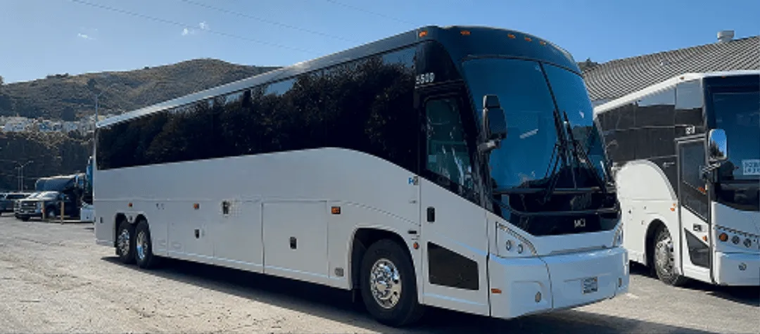 White 40 Passenger Motorcoach with tinted windows for charter bus rental