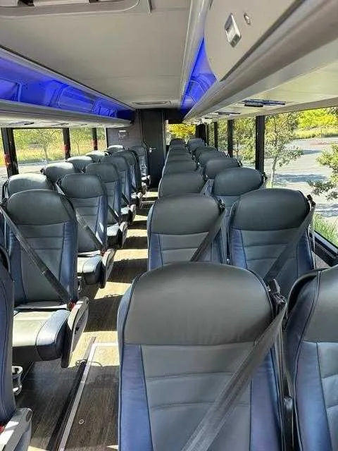 36 Passenger Motorcoach, the inside featuring LED accent lighting and overhead parcel racks