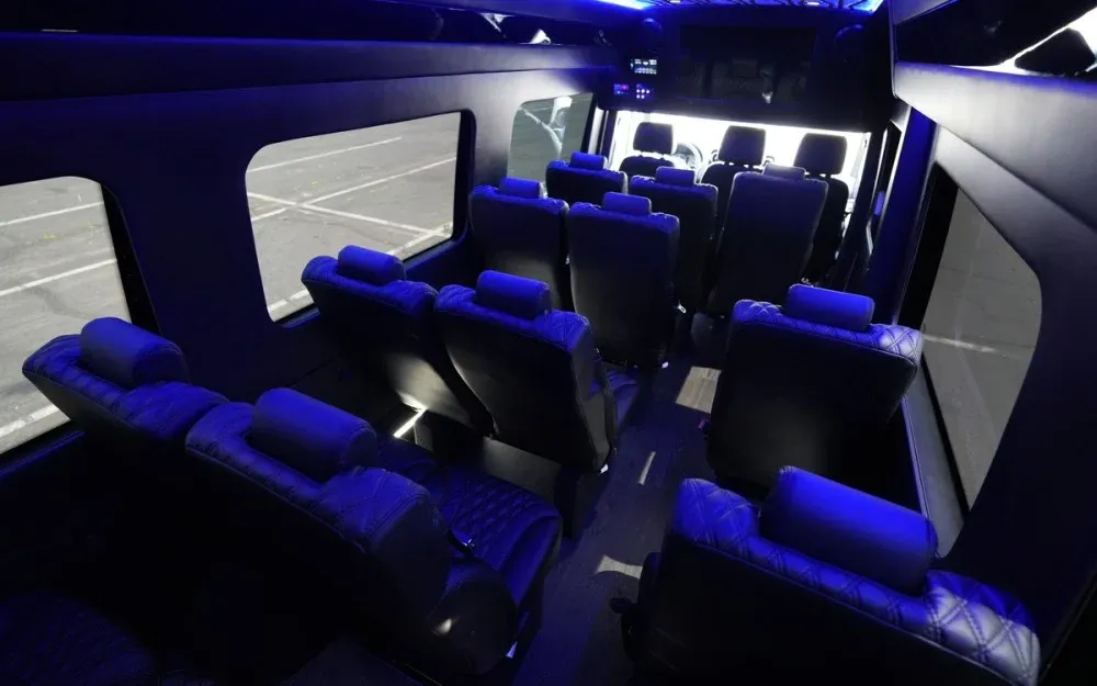 White Luxury Sprinter Shuttle Van, the inside featuring LED accent lighting